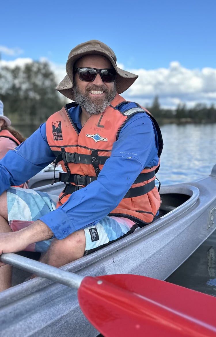 Tim canoeing on camp